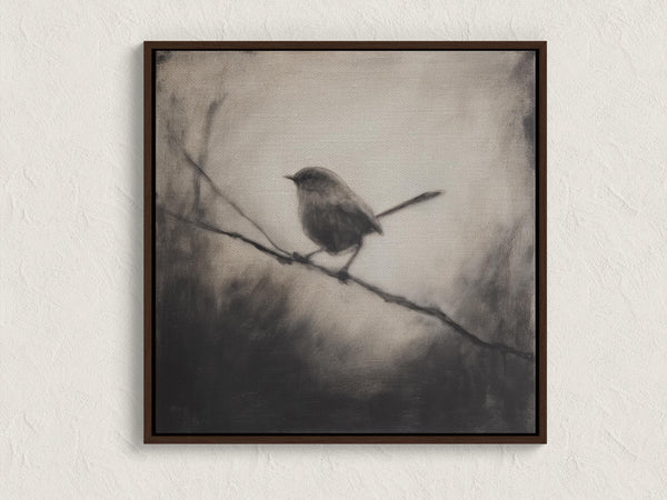 Canvas wall art of a solitary robin in black and white. A peaceful charcoal bird print, full of stillness. Ready to hang.