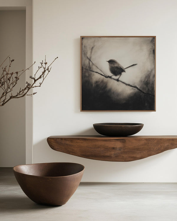 Canvas wall art of a solitary robin in black and white. A peaceful charcoal bird print, full of stillness. Ready to hang.