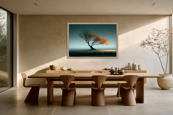Leaning Light tree artwork in a light wood frame above a long dining table.