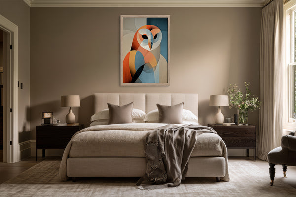 Framed geometric owl artwork centered above a bed with neutral bedding and dark bedside tables.