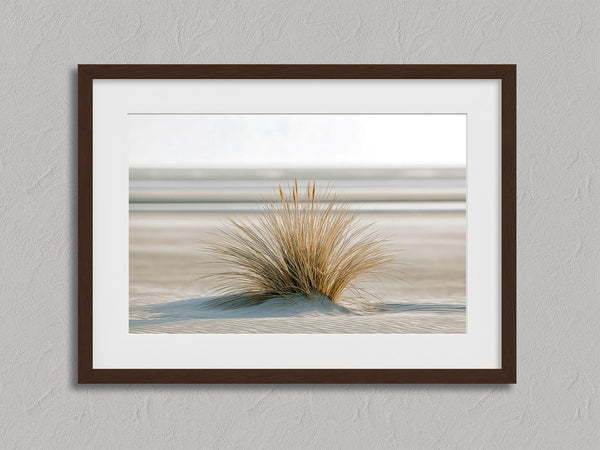Dune Stillness shown in a walnut frame with a white border or mount.
