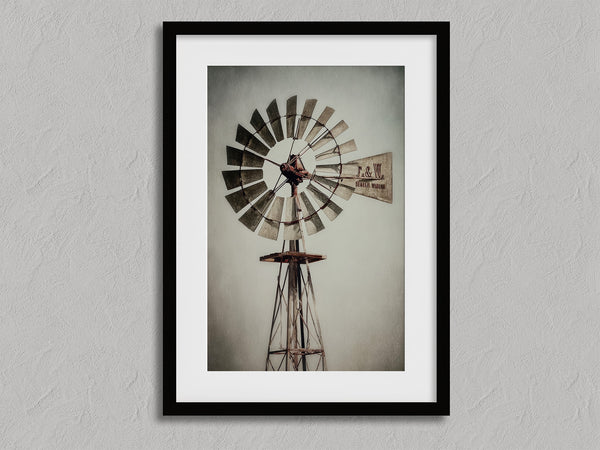 Prairie Windmill shown in a black frame with a white border or mount.