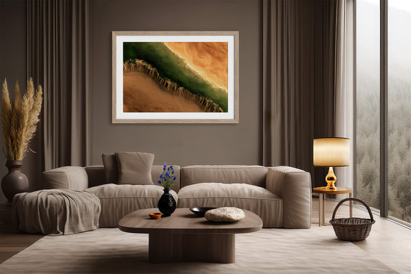 A framed landscape art print featuring a green and orange canyon scene
