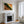 A framed landscape art print featuring a green and orange canyon scene