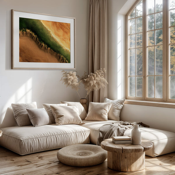 A framed landscape art print featuring a green and orange canyon scene