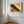 A framed landscape art print featuring a green and orange canyon scene