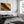 A framed landscape art print featuring a green and orange canyon scene