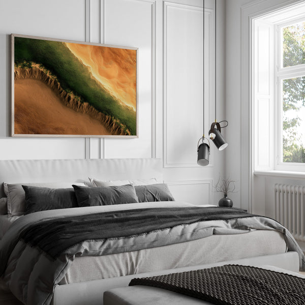 A framed landscape art print featuring a green and orange canyon scene