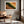 A framed landscape art print featuring a green and orange canyon scene