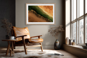 A framed landscape art print featuring a green and orange canyon scene