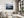 Ethereal Dawn coastal wall art featuring Northumbrian castle ruins, rocky shoreline and calm sea at sunrise