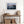 Ethereal Dawn coastal wall art featuring Northumbrian castle ruins, rocky shoreline and calm sea at sunrise