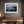 Ethereal Dawn coastal wall art featuring Northumbrian castle ruins, rocky shoreline and calm sea at sunrise