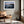 Ethereal Dawn coastal wall art featuring Northumbrian castle ruins, rocky shoreline and calm sea at sunrise