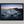 Ethereal Dawn coastal wall art featuring Northumbrian castle ruins, rocky shoreline and calm sea at sunrise