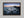 Ethereal Dawn coastal wall art featuring Northumbrian castle ruins, rocky shoreline and calm sea at sunrise