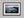 Ethereal Dawn coastal wall art featuring Northumbrian castle ruins, rocky shoreline and calm sea at sunrise