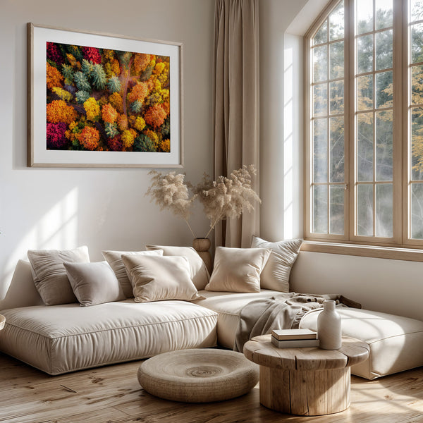 A large framed wall art print featuring a dense, colourful abstract floral or forest-like pattern in red, orange, yellow, green, and blue.