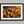 Woodland Mosaic shown in a black frame with a white border or mount.