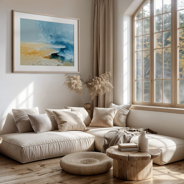 Abstract coastal artwork with layered blue waves, textured ivory forms and a warm golden shoreline.