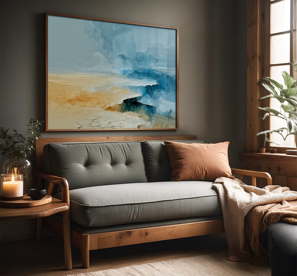 Abstract coastal artwork with layered blue waves, textured ivory forms and a warm golden shoreline.