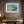 Abstract coastal artwork with layered blue waves, textured ivory forms and a warm golden shoreline.