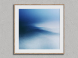 Blue Meridian shown in an oak frame with a white border or mount.