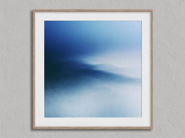 Blue Meridian shown in an oak frame with a white border or mount.