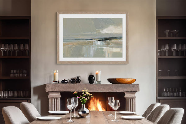 Matted Pale Estuary print in a light wood frame above a fireplace and set dining table.