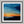 Last Light Beyond The Fields shown in a black frame with a white border or mount.