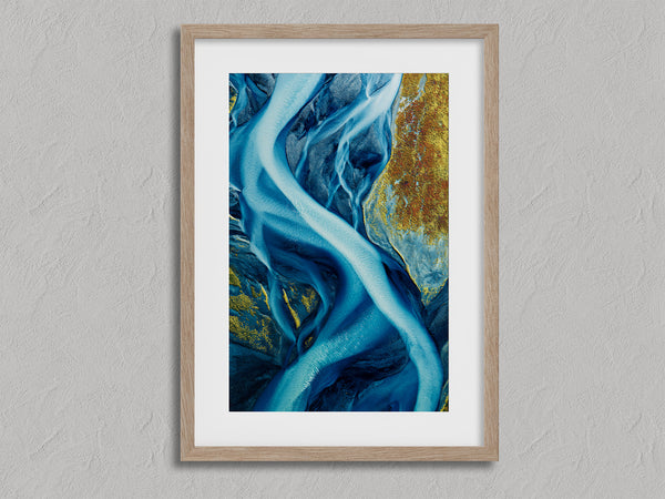 Arctic Threads shown in an oak frame with a white border or mount.