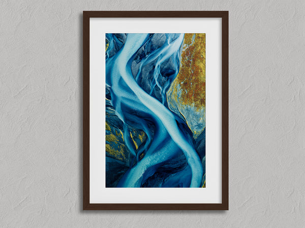 Arctic Threads shown in a walnut frame with a white border or mount.