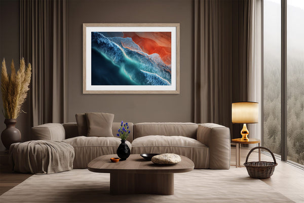Ember Tide print in a light wood frame above a cream sofa, with a floor lamp nearby.