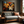 Canvas wall art of autumn leaves in amber, gold, and mahogany with dewdrops. A warm, vibrant seasonal print. Ready to hang.