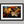 Canvas wall art of autumn leaves in amber, gold, and mahogany with dewdrops. A warm, vibrant seasonal print. Ready to hang.