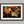 Canvas wall art of autumn leaves in amber, gold, and mahogany with dewdrops. A warm, vibrant seasonal print. Ready to hang.