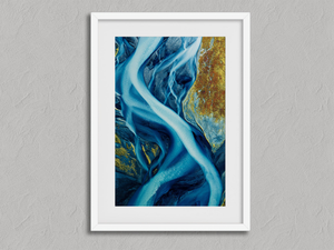 Arctic Threads – Aerial Glacial River Wall Art Print in a white frame with a mount
