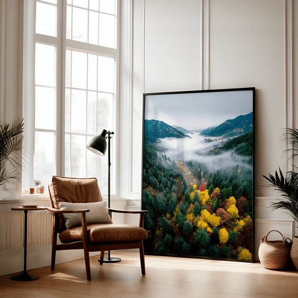 Framed fine art print of a misty valley in fall colours. Red, gold, and evergreen forest hues captured in a vivid autumn woodland scene.