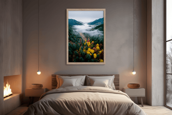Framed fine art print of a misty valley in fall colours. Red, gold, and evergreen forest hues captured in a vivid autumn woodland scene.