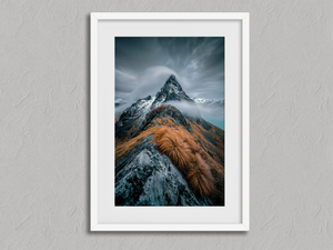 Cloudbound Peak – Snowy Mountain Wall Art Print in a white frame with a mount