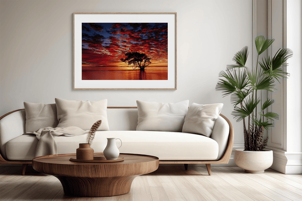 Framed wall art of a solitary ocean tree at sunrise. A serene fine art print capturing dawn’s quiet light over sea and sky.