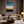 Framed wall art of an abstract seascape in deep indigo, blue, and gold. A minimalist horizon print evoking calm and renewal.