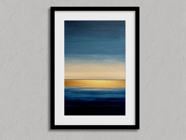 Framed wall art of an abstract seascape in deep indigo, blue, and gold. A minimalist horizon print evoking calm and renewal.