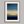 Framed wall art of an abstract seascape in deep indigo, blue, and gold. A minimalist horizon print evoking calm and renewal.
