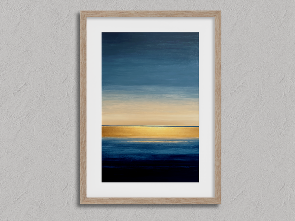 Framed wall art of an abstract seascape in deep indigo, blue, and gold. A minimalist horizon print evoking calm and renewal.