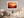 Warm desert sunset wall art styled in a calm neutral interior