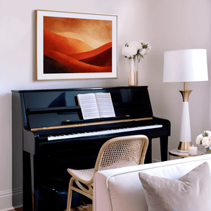 Warm desert sunset wall art styled in a calm neutral interior