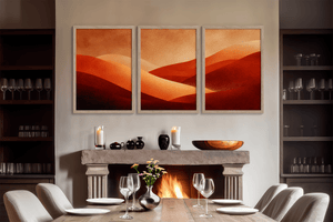 Framed desert sunset triptych wall art in warm red orange and amber tones