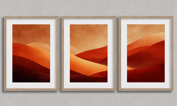 Framed desert sunset triptych wall art in warm red and amber tones. A soft, minimalist watercolour print that brings warmth and calm.