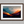 Framed wall art of layered mountains in twilight tones. Deep blues and sienna hues bring bold calm.